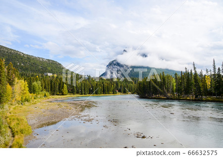 Autumn Canadian Rockies Bow River and cloud-covered Mount Randle (Alberta, Canada) 66632575