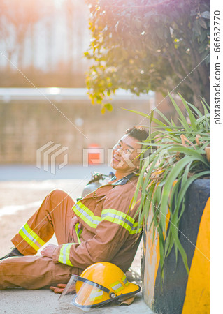 Asian male and female firefighter portrait, young smiling fireman in uniform 377 Asian male and female firefighter portrait, young smiling fireman in uniform 377 66632770
