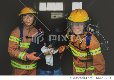 Asian male and female firefighter portrait, young smiling fireman in uniform 292 Asian male and female firefighter portrait, young smiling fireman in uniform 292 66632784
