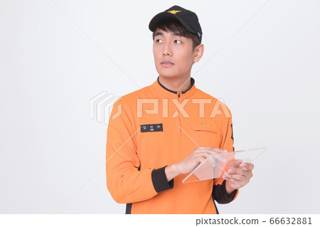 Asian male and female firefighter portrait, young smiling fireman in uniform 124 Asian male and female firefighter portrait, young smiling fireman in uniform 124 66632881