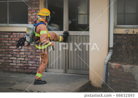 Asian male and female firefighter portrait, young smiling fireman in uniform 299 Asian male and female firefighter portrait, young smiling fireman in uniform 299 66632893