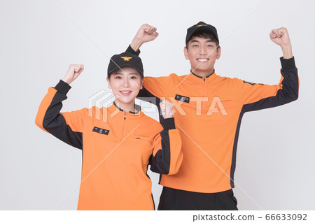 Asian male and female firefighter portrait, young smiling fireman in uniform 107 Asian male and female firefighter portrait, young smiling fireman in uniform 107 66633092