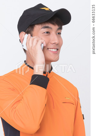 Asian male and female firefighter portrait, young smiling fireman in uniform 068 66633135