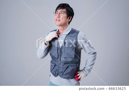 A studio portrait of Asian man making a confident smile 444 A studio portrait of Asian man making a confident smile 444 66633625