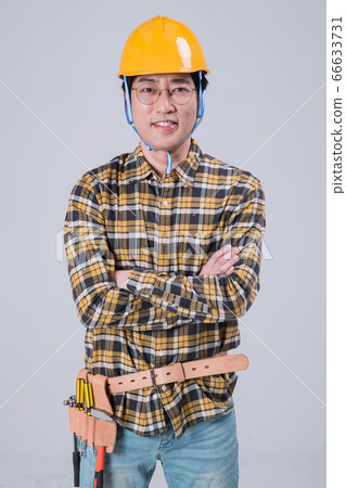 A studio portrait of Asian man making a confident smile 391 A studio portrait of Asian man making a confident smile 391 66633731
