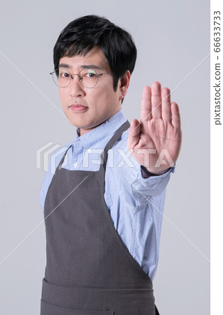 A studio portrait of Asian man making a confident smile 288 66633733