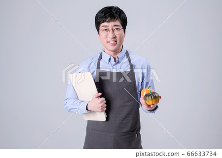 A studio portrait of Asian man making a confident smile 342 A studio portrait of Asian man making a confident smile 342 66633734