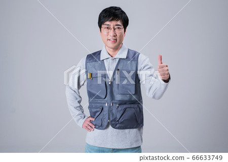 A studio portrait of Asian man making a confident smile 454 A studio portrait of Asian man making a confident smile 454 66633749