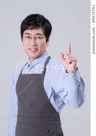A studio portrait of Asian man making a confident smile 266 A studio portrait of Asian man making a confident smile 266 66633761