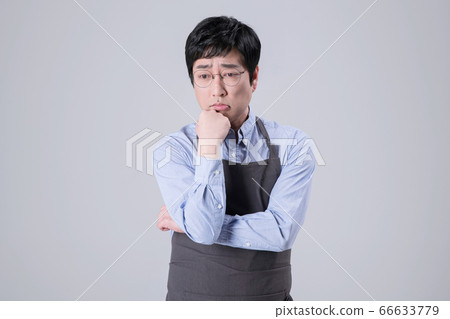 A studio portrait of Asian man making a confident smile 312 A studio portrait of Asian man making a confident smile 312 66633779