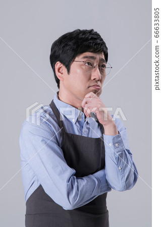 A studio portrait of Asian man making a confident smile 240 A studio portrait of Asian man making a confident smile 240 66633805
