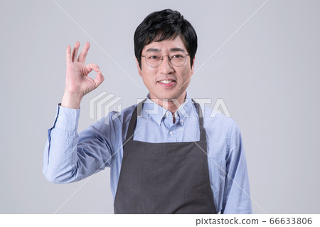 A studio portrait of Asian man making a confident smile 283 66633806