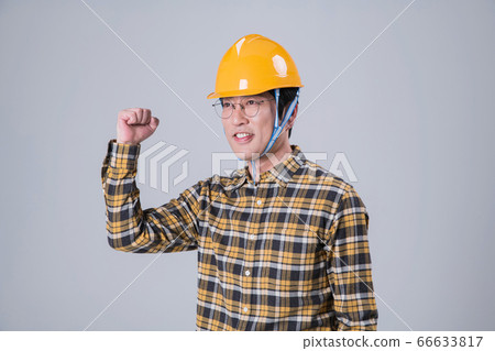 A studio portrait of Asian man making a confident smile 379 A studio portrait of Asian man making a confident smile 379 66633817