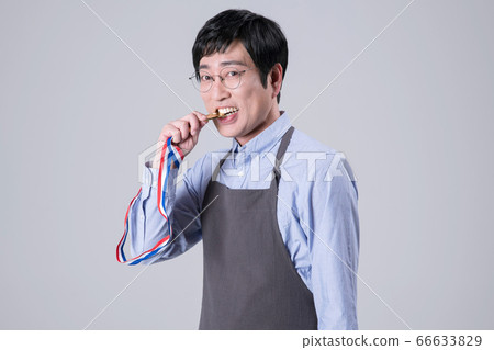 A studio portrait of Asian man making a confident smile 316 A studio portrait of Asian man making a confident smile 316 66633829