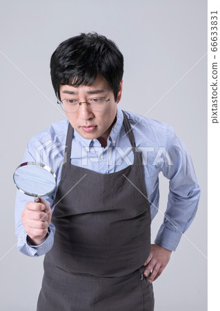 A studio portrait of Asian man making a confident smile 365 A studio portrait of Asian man making a confident smile 365 66633831