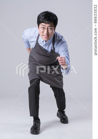 A studio portrait of Asian man making a confident smile 323 A studio portrait of Asian man making a confident smile 323 66633832