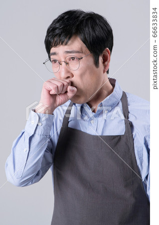 A studio portrait of Asian man making a confident smile 260 A studio portrait of Asian man making a confident smile 260 66633834
