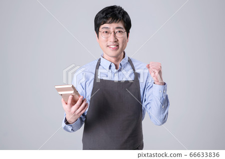 A studio portrait of Asian man making a confident smile 265 A studio portrait of Asian man making a confident smile 265 66633836