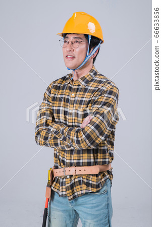 A studio portrait of Asian man making a confident smile 399 A studio portrait of Asian man making a confident smile 399 66633856