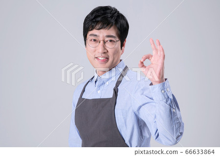 A studio portrait of Asian man making a confident smile 257 66633864