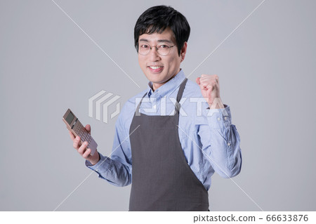 A studio portrait of Asian man making a confident smile 334 A studio portrait of Asian man making a confident smile 334 66633876