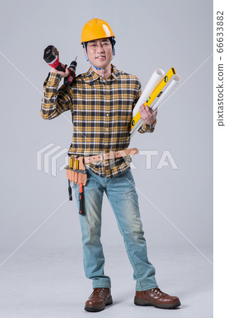 A studio portrait of Asian man making a confident smile 392 66633882