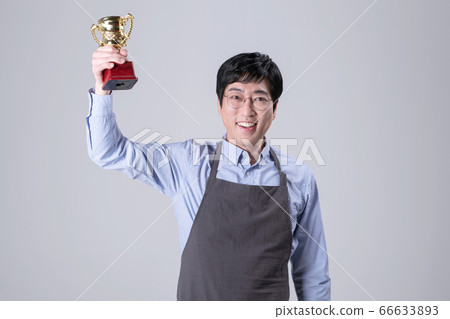 A studio portrait of Asian man making a confident smile 254 A studio portrait of Asian man making a confident smile 254 66633893