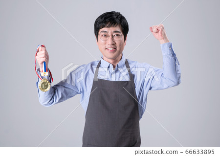 A studio portrait of Asian man making a confident smile 311 66633895