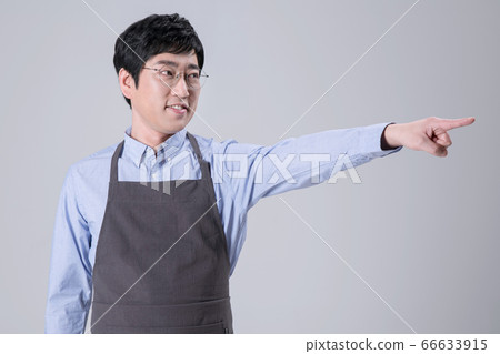 A studio portrait of Asian man making a confident smile 244 66633915