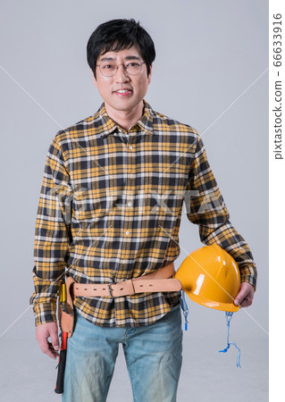 A studio portrait of Asian man making a confident smile 373 A studio portrait of Asian man making a confident smile 373 66633916