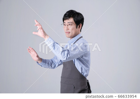 A studio portrait of Asian man making a confident smile 253 A studio portrait of Asian man making a confident smile 253 66633954