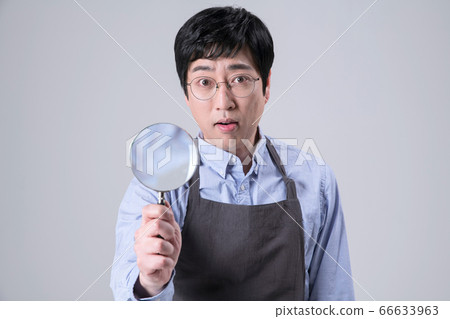 A studio portrait of Asian man making a confident smile 340 A studio portrait of Asian man making a confident smile 340 66633963