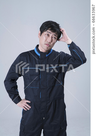 A studio portrait of Asian man making a confident smile 128 A studio portrait of Asian man making a confident smile 128 66633967