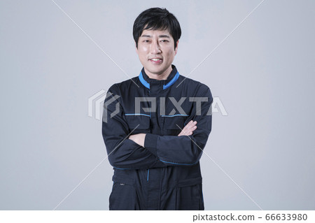 A studio portrait of Asian man making a confident smile 143 A studio portrait of Asian man making a confident smile 143 66633980