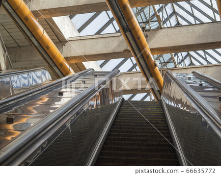 top of subway escalator up moving staircase 66635772
