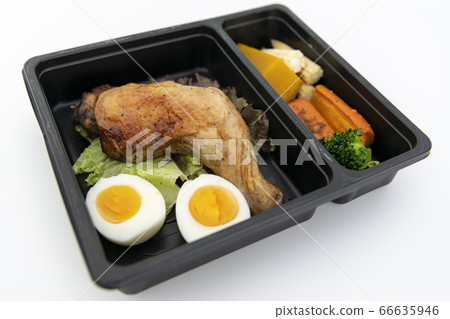 Top view of roasted chicken wing and egg with boiled vegetables pumpkin carrot broccoli. Top view of roasted chicken wing and egg with boiled vegetables pumpkin carrot broccoli. 66635946