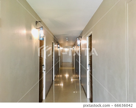 Walkway simple interior design with storm lantern hanging decorative on wall in hotel 66636042