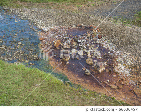 Colorful rhyolit red, orange and yellow boiling 66636457