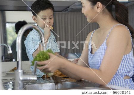 Mother and boy relaxing in the kitchen Mother and boy relaxing in the kitchen 66638141
