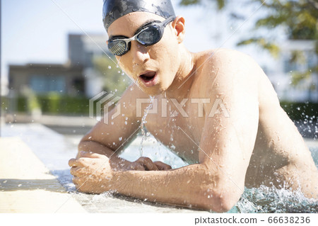 Young men swimming 66638236