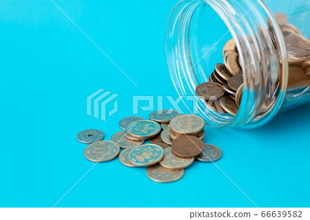 Spilling money blue background 66639582