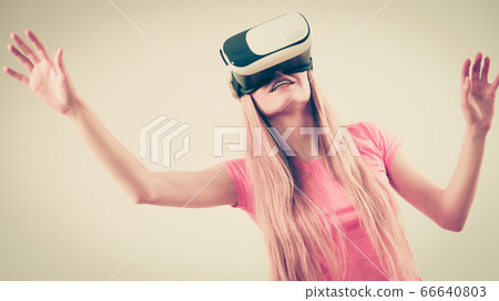 Girl wearing virtual reality goggles. Girl wearing virtual reality goggles. 66640803