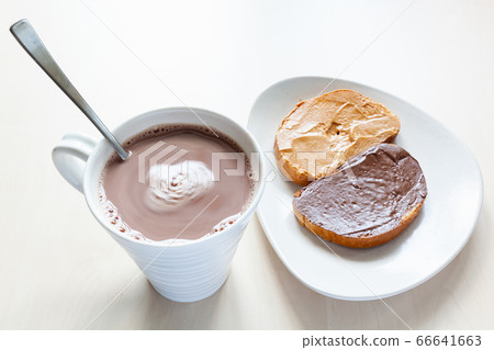top view of mug with hot chocolate and toasts top view of mug with hot chocolate and toasts 66641663