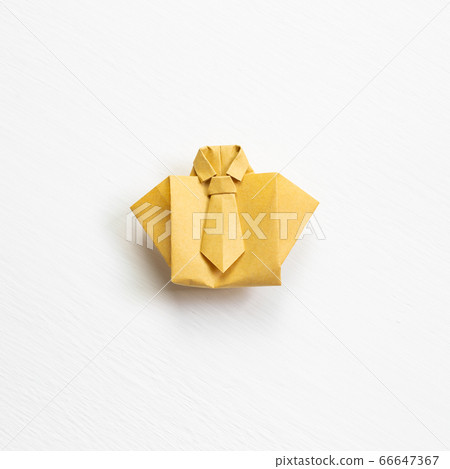 Yellow paper shirt origami on white background Yellow paper shirt origami on white background 66647367