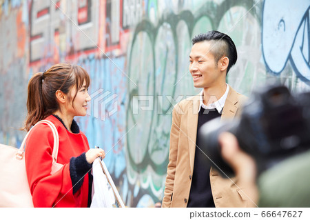 Street corner snap cameraman graffiti tagging 66647627