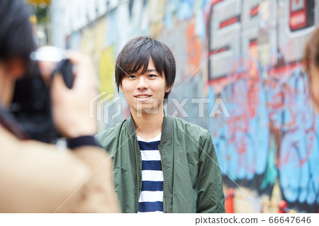 Street corner snap cameraman graffiti tagging 66647646