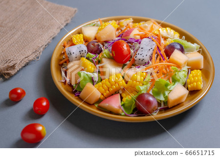 Fruits salad and vegetable in dish plate on gray 66651715