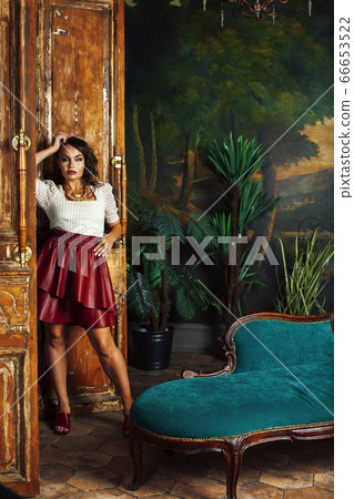 young pretty rich italian woman in golden luxury room interior, elegant styled hotel, people on vacation 66653522