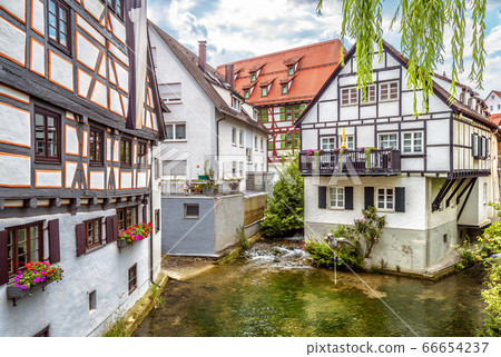 Street with vintage half-timbered houses in old Street with vintage half-timbered houses in old 66654237