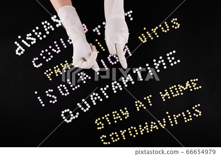 Two hands in medical gloves with fuck and fig gesture. Pandemic headline clipping words Two hands in medical gloves with fuck and fig gesture. Pandemic headline clipping words 66654979